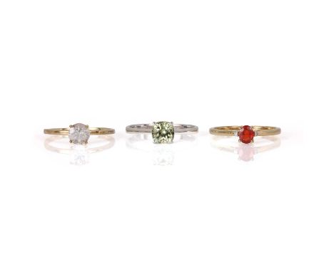 Three 9ct gold gem set rings, comprising a ring set with an oval reddish-orange treated sapphire and two small round brillian