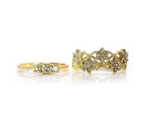 Two coloured diamond rings, comprising an 18ct gold coloured diamond three stone ring, with graduated round brilliant cut dia