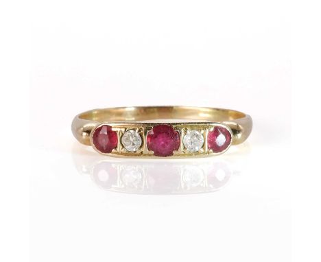 An 18ct gold ruby and diamond ring,   with circular cut rubies alternating with an eight cut and a Swiss cut diamond, grain s