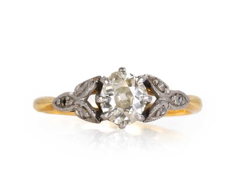 A gold single stone diamond ring,  with an ovoid cut old cut diamond, 5.94mm x 5.17mm, claw set in white to white foliate sho