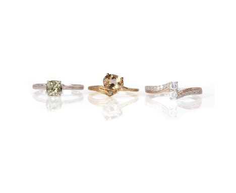 Three 9ct gold gem set rings, comprising:a 9ct gold citrine and diamond ring,with an oval citrine, 8.00mm x 6.00mm, and a rou