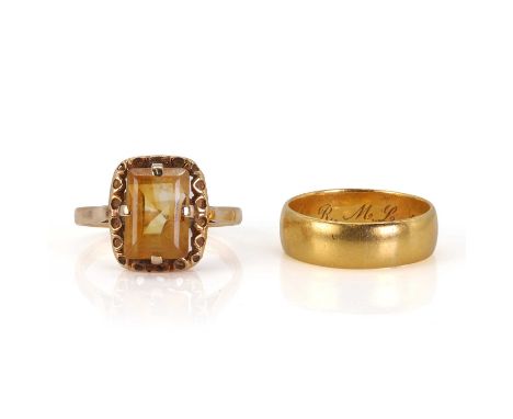 A gold wedding band and a gold citrine ring, comprising a plain gold wedding ring, in a low 'D' profile, 6.00mm wide, tested 