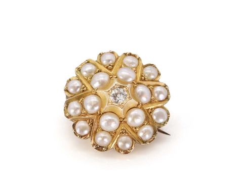 A late Victorian split pearl and diamond star brooch/pendant, with an old European diamond bead set to the centre, to a radia