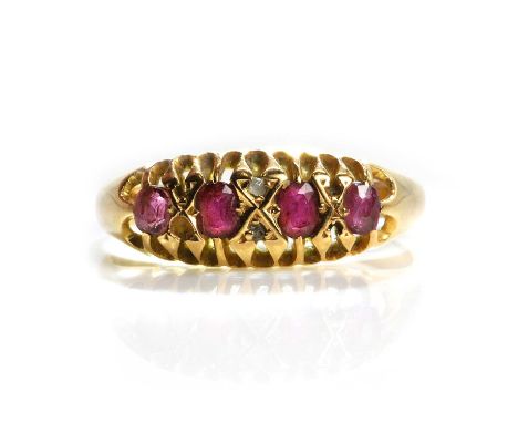 An Edwardian 18ct gold five stone ruby ring,  with five graduating oval mixed cut rubies set to belcher collets, interspaced 