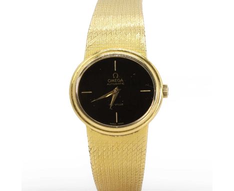 An 18ct gold Omega De Ville automatic watch,   an oval stepped case, 26mm x 24mm, with a brown dial, gilt baton hour markers 