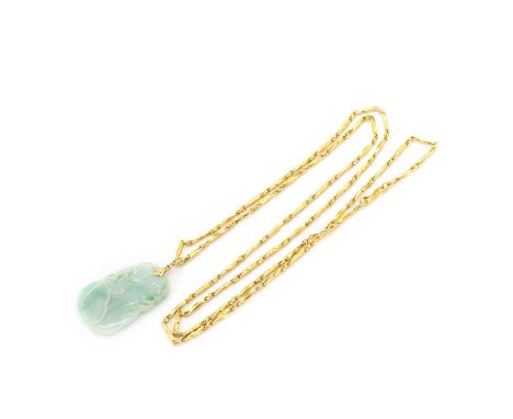 A gold jade pendant and chain, a carved jade pendant, with a gold fixed bale, 42mm long, suspended by a gold faceted and engr