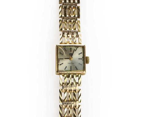 A ladies' 9ct gold Omega mechanical bracelet watch,  a plain square case, 14mm x 14mm, with a silvered dial, baton hour marke