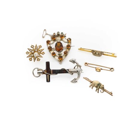 A collection of gold and silver brooches, comprising a gold elephant bar brooch, base metal pin, 45mm x 13mm, stamped 9C, tes