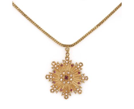 An Indian gold gold ruby and split pearl pendant, the pendant with a central round cut ruby surrounded by split pearls and ro