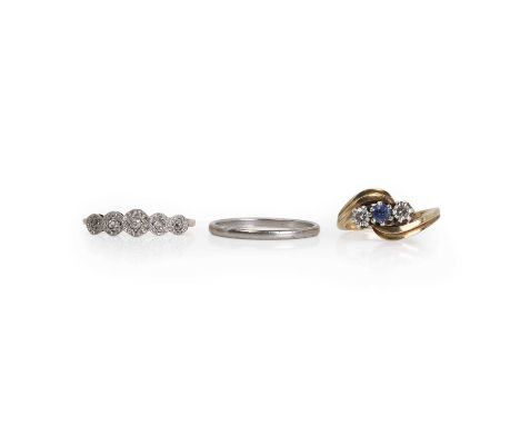 Two gold rings and a platinum band, comprising a 9ct gold sapphire and diamond three stone crossover ring, with a central rou