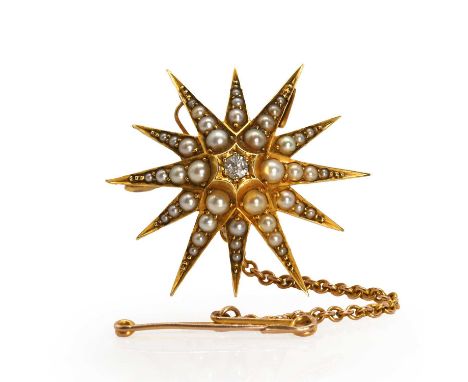 An Edwardian gold split pearl and diamond starburst brooch, with a central Swiss cut diamond, grain set to a raised star, wit