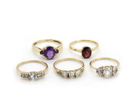 A group of five 9ct gold gem set rings, comprising a 9ct gold amethyst ring, a 9ct gold colourless stone ring, a 9ct gold col