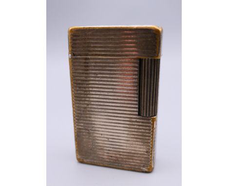 A plated Dupont lighter.  5.75 x 3.5 cm. 