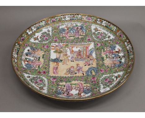 A large Canton famille rose ceramic charger. 56 cm diameter.