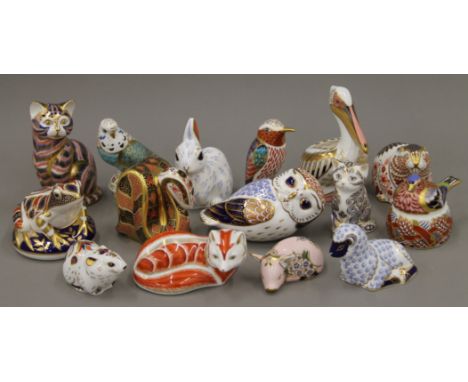 A collection of Royal Crown Derby paperweights.