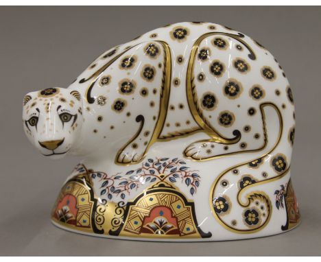 A Royal Crown Derby Snow Leopard paperweight. 16 cm long.