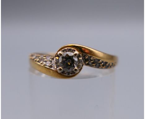 An 18 ct gold and diamond crossover ring, approximately 0.25 carat of diamonds. Ring size P/Q. 4.3 grammes total weight.