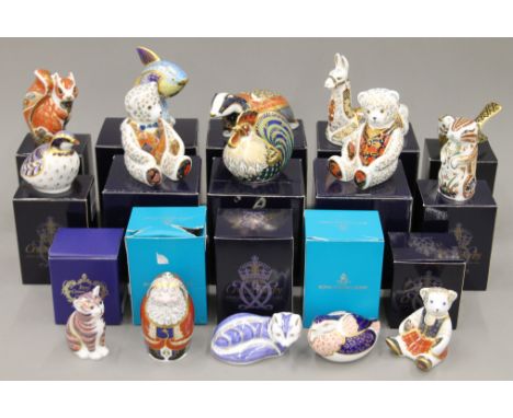 A collection of boxed Royal Crown Derby paperweights.