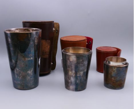 Three sets of leather cased silver plated stirrup cups, two sets engraved with initials RWWP, the other set engraved WP.  Cup