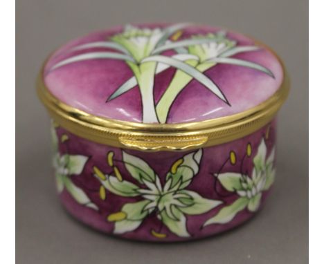 A boxed Moorcroft enamel Fuchsia box. 5.5 cm diameter.