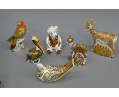 A collection of Royal Crown Derby paperweights.