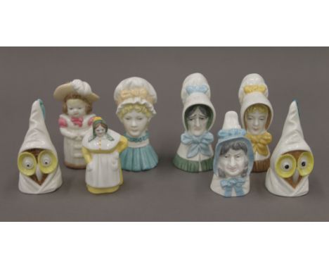 A collection of Royal Worcester candle snuffers.