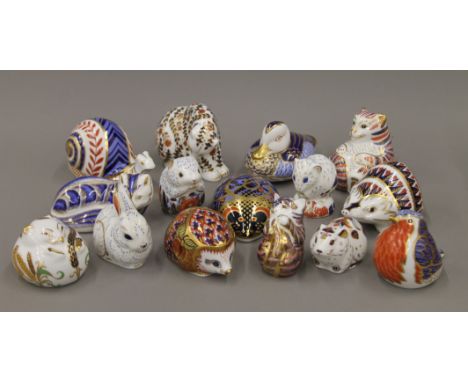 A collection of Royal Crown Derby paperweights.