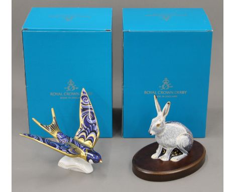 Two boxed Royal Crown Derby paperweights, Starlight Hare and Swallow.