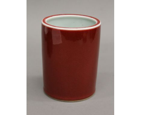 A small Chinese ceramic brush pot, with six character mark to base. 13.5 cm high.