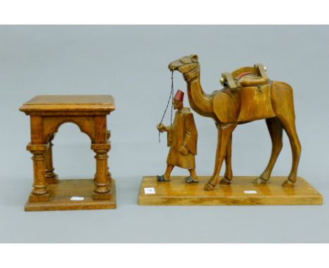 An oak bracket and a wooden model camel. The latter 37 cm long.