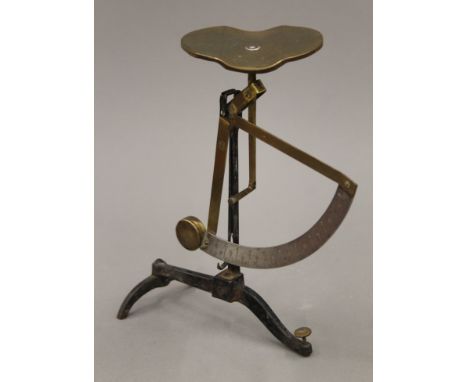A boxed set of antique letter scales. The box 19.5 cm wide.