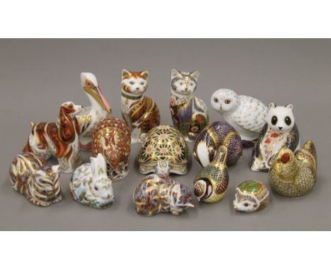 A collection of Royal Crown Derby paperweights including: cats, owl, rabbit, hedgehog, armadillo, tortoise, pelican, spaniel,