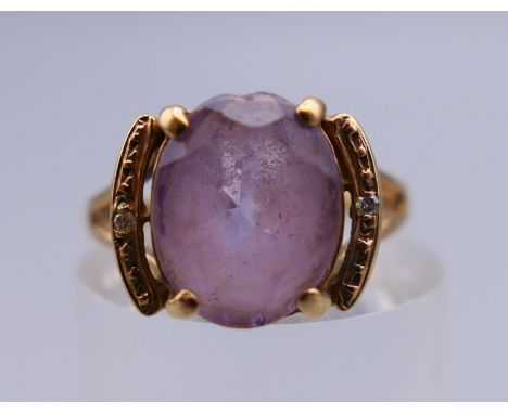 A 9 ct gold amethyst ring. Ring size K. 2.1 grammes total weight.