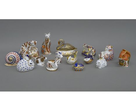 A collection of Royal Crown Derby paperweights.