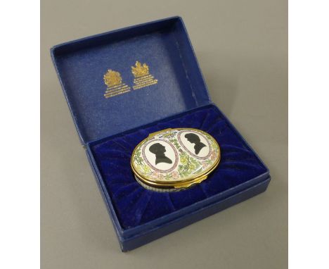 A boxed Halcyon Days Charles and Diana enamel patch box. 
