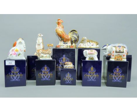 Ten boxed Royal Crown Derby paperweights.