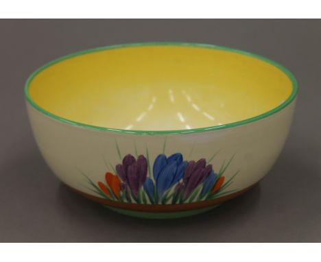 An A J Wilkinson Ltd honey glaze bowl, decorated in the Clarice Cliff Crocus pattern. 19.5 cm diameter.