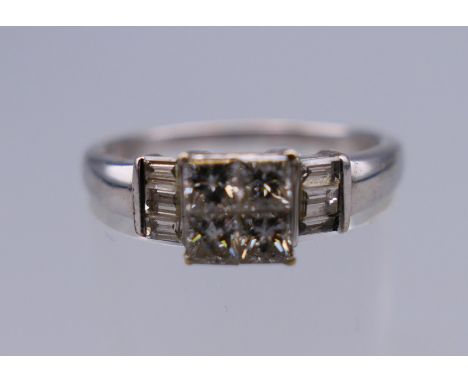 An Art Deco style 18 ct white gold and diamond ring. Ring size O/P. 3.2 grammes total weight.