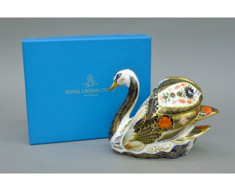 A boxed Royal Crown Derby Old Imari Solid Gold Band Swan paperweight.