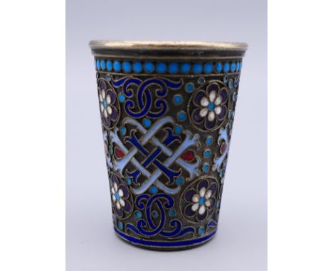 A Russian silver and enamel tot cup.  4.75 cm high. 