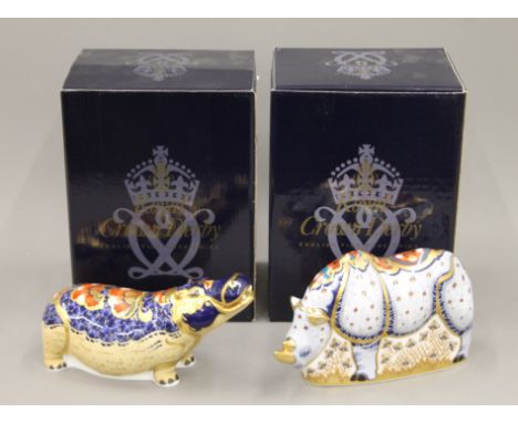 Two boxed Royal Crown Derby paperweights, White Rhino and Hippopotamus.