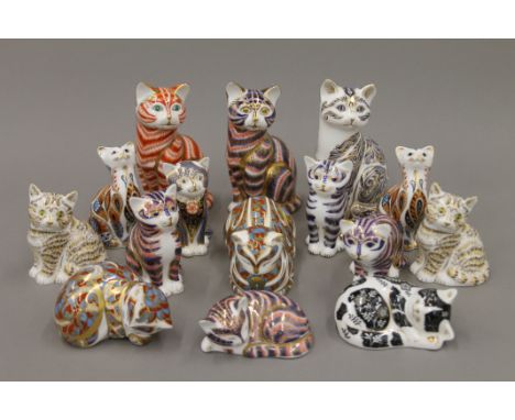 A collection of Royal Crown Derby cat form paperweights. 