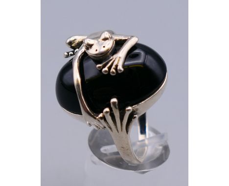 A silver onyx frog ring. Ring size R/S.