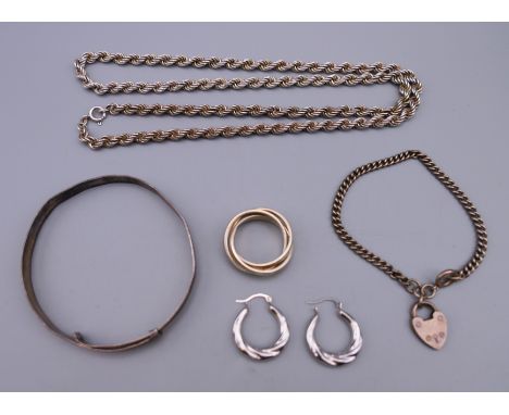 A quantity of silver jewellery including: a bangle, a chain, a ring, a padlock bracelet and a pair of earrings. Chain 60 cm l