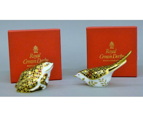 Two boxed Royal Crown Derby Aura design paperweights, frog and song bird.