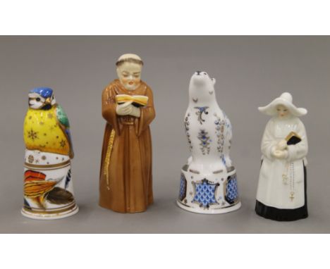 Four Royal Worcester candle snuffers. The largest 12 cm high.