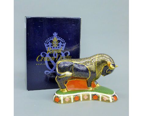 A boxed Royal Crown Derby bull form paperweight. 