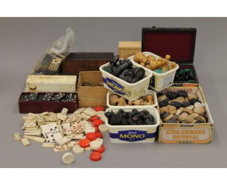 A collection of gaming pieces including a complete weighted chess set.