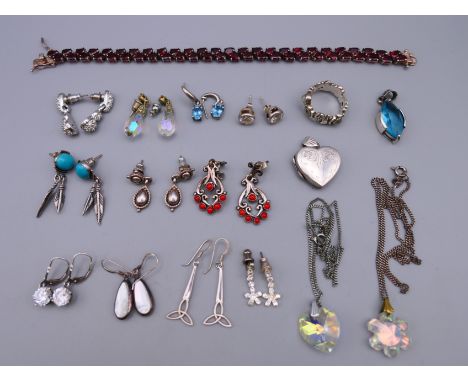 A quantity of silver jewellery including: a ring, earrings, a pendant, a bracelet, necklaces and a heart shaped locket.