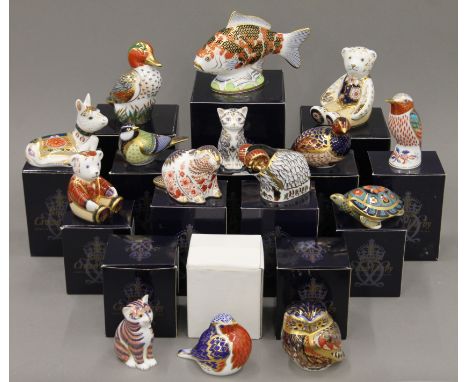 A collection of boxed Royal Crown Derby paperweights.